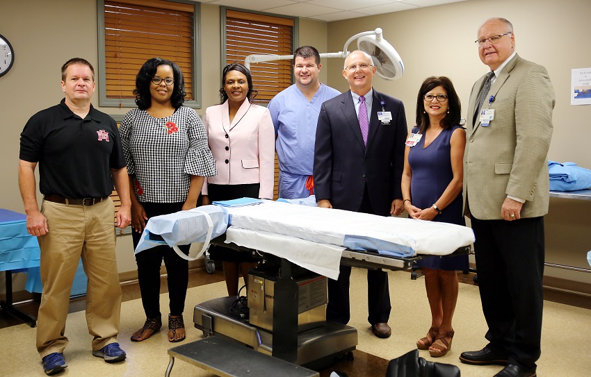 From left, East Mississippi Community College Paramedic instructor Chris Kelly, EMCC Surgical Technology Program instructor Janan Rush, EMCC Division of Nursing and Allied Health Director Dr. Tonsha Emerson, Baptist Memorial Hospital-Golden Triangle Director of Perioperative Services Derrick Forrester, Baptist Administrator and CEO Paul Cade, Baptist Chief Nursing Officer Mary Ellen Sumrall and Baptist Assistant Administrator Bill Lancaster in Baptist Golden Triangle’s training facility that will house two EMCC programs. From left, East Mississippi Community College Paramedic instructor Chris Kelly, EMCC Surgical Technology Program instructor Janan Rush, EMCC Division of Nursing and Allied Health Director Dr. Tonsha Emerson, Baptist Memorial Hospital-Golden Triangle Director of Perioperative Services Derrick Forrester, Baptist Administrator and CEO Paul Cade, Baptist Chief Nursing Officer Mary Ellen Sumrall and Baptist Assistant Administrator Bill Lancaster in Baptist Golden Triangle’s training facility that will house two EMCC programs.