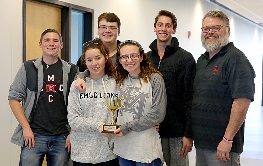 East Mississippi Community College’s quiz bowl team took first place in the 2019 Community College Sectional Championship Quiz Bowl Tournaments Jan. 25 and qualified to compete nationally. Pictured in the front row with the team’s trophy are, from left, Hayley McCann and Belle Ferrebee. In the back row are, from left, Justin Labonte, Cameron Wilcox, Jaden Bennett, and EMCC Quiz Bowl Coach Scott Baine. East Mississippi Community College’s quiz bowl team took first place in the 2019 Community College Sectional Championship Quiz Bowl Tournaments Jan. 25 and qualified to compete nationally. Pictured in the front row with the team’s trophy are, from left, Hayley McCann and Belle Ferrebee. In the back row are, from left, Justin Labonte, Cameron Wilcox, Jaden Bennett, and EMCC Quiz Bowl Coach Scott Baine.